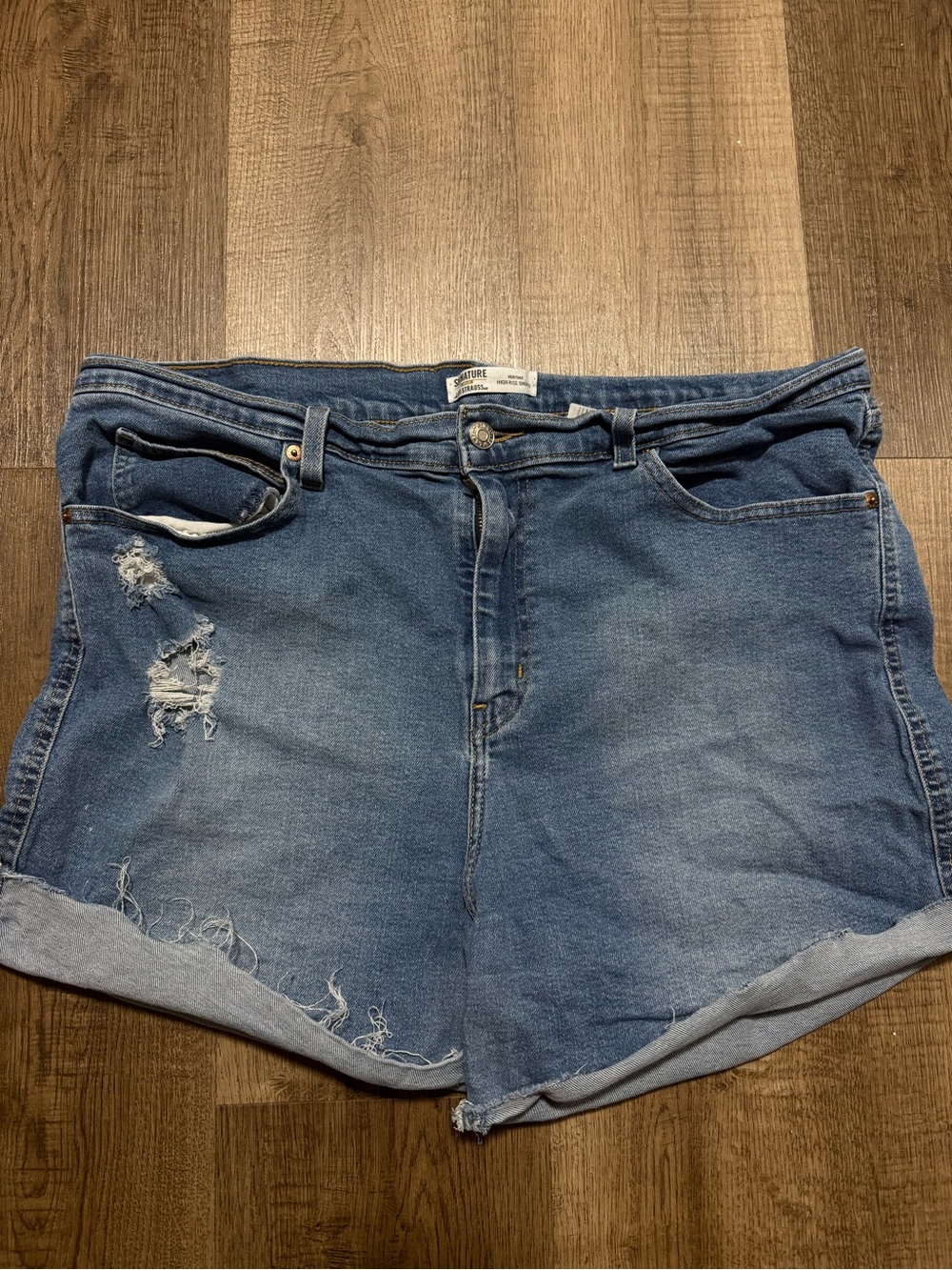 High-Rise Distressed Denim Shorts in Blue